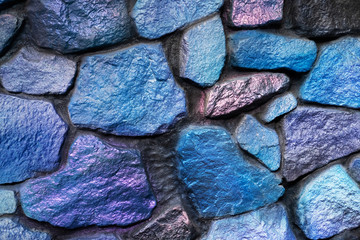 Fragment of a wall from a chipped blue and lilac stone
