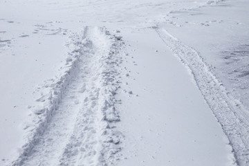 Tracks in the snow. Dangerous road.