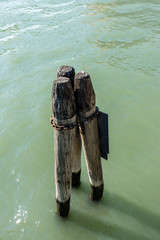 Italy, Venice, a wooden pole in body of water
