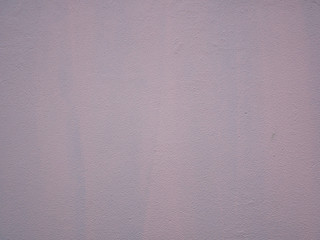 Fototapeta premium Rough pink painted wall, stucco texture.