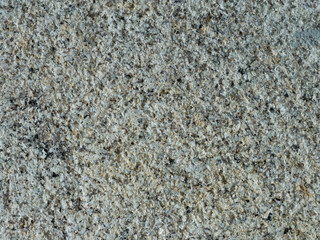 Weathered, old granite wall with rough texture background