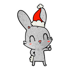 cute textured cartoon of a rabbit wearing santa hat