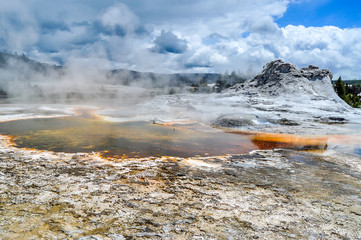 A Geothermal Pool and its Geyser in Yellowstone National Park