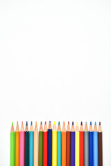 Multi - colored pencils, children's creativity, drawing colorful bright pencils on white background