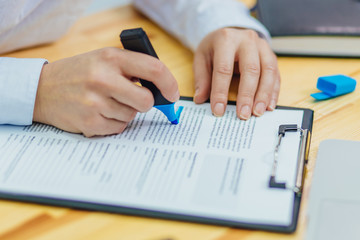 Close up of woman's hand holding marker, drawing, working project, planning strategy, using sticky notes and scrum. University student studying, learning language, examination. Education concept.