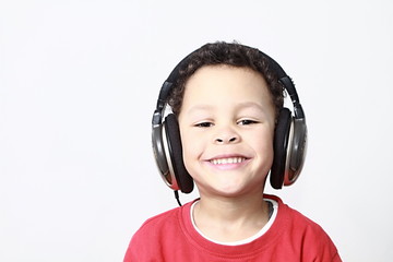 boy with headphones enjoying music with white background