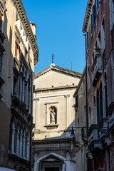 Fototapeta na wymiar Italy, Venice, Venice, LOW ANGLE VIEW OF OLD BUILDING AGAINST CLEAR BLUE SKY