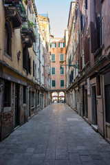 Fototapeta na wymiar Italy, Venice, a narrow city street