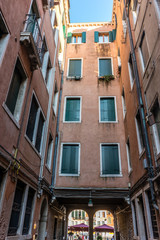 Fototapeta premium Italy, Venice, a view of a city street in front of a brick building