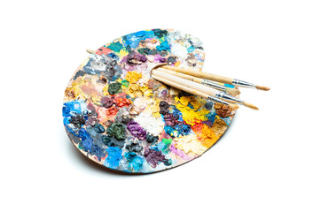 Art palette and a brush on white background.