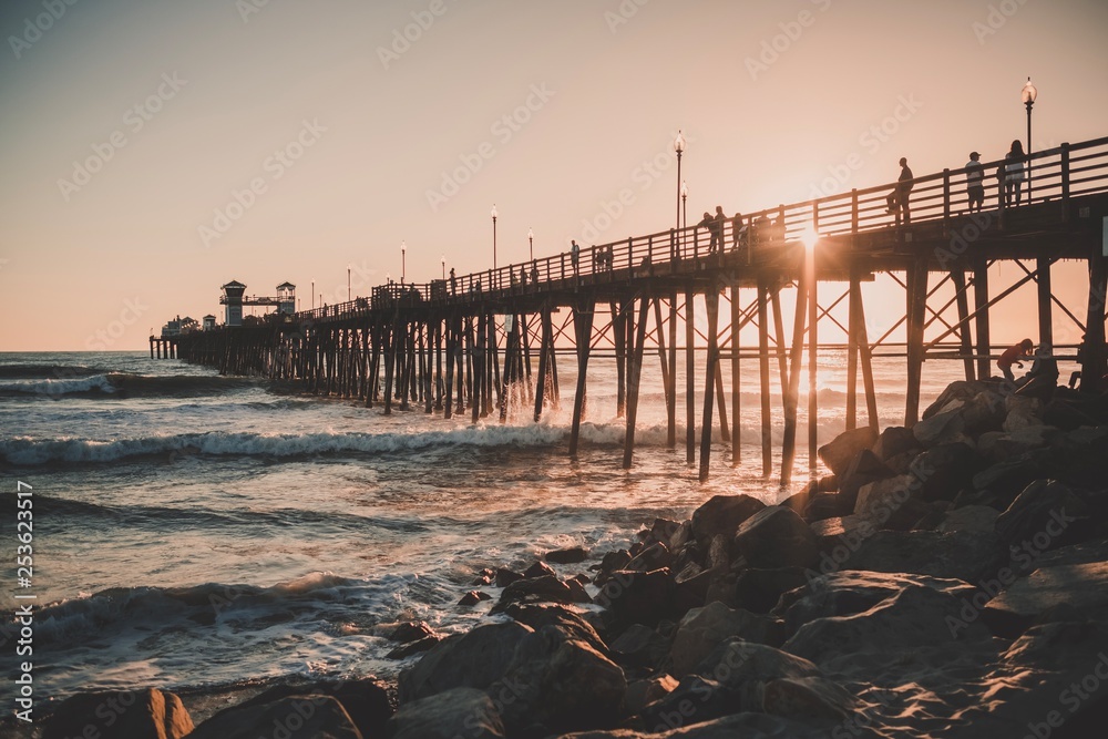 Wall mural pier at sunset