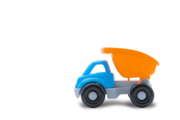 Naklejka premium Toy truck on a white background, close-up, concept of building work or child's play