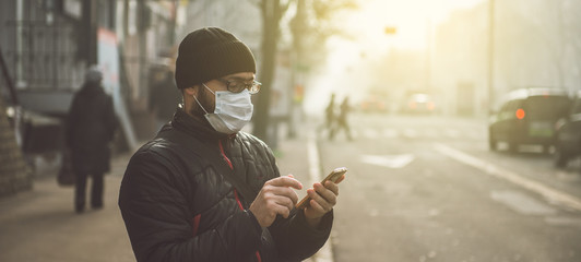 A man wearing a mask on the street. Protection against virus and grip