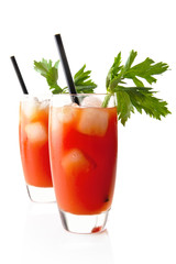 Bloody Mary with ice cubes with celery isolated on white