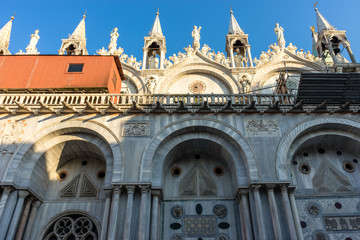 Italy, Venice, St Mark's Basilica, a church with a clock on the side of St Mark's Basilica