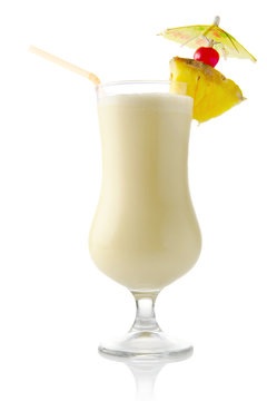 Pina colada coconut cocktail with ice on white background