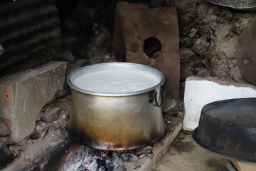 milk is boiled in a large cauldron and cheese is made.artvin/savsat