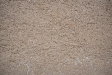 Rough, old, off-white concrete wall surface texture