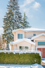 Houses in suburb at Winter in the north America. Luxury houses covered nice snow.