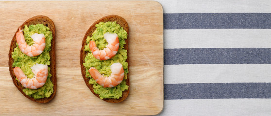 sandwich shrimp and guacamole on background baner