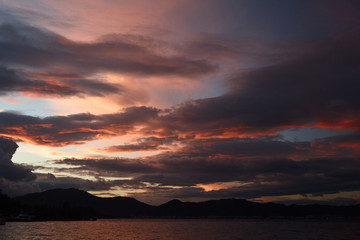 Decline or dawn over the sea.Fantastically beautiful clouds of rising or decline are reflected in waves