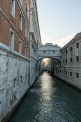 Fototapeta na wymiar Italy, Venice, Bridge of Sighs, water next to the building with Bridge of Sighs in the background