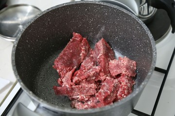 Selection of different cuts of fresh raw red meat in a supermarket 