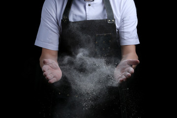 hand clap of chef with flour on black background isolated