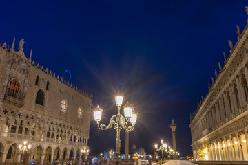 Italy, Venice, Piazza San Marco, ILLUMINATED BUILDINGS IN CITY AT NIGHT