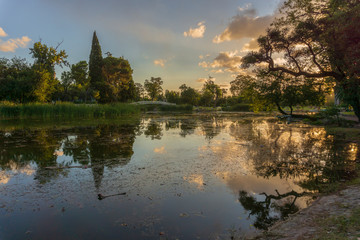 warm sunset during summer at Parque Sarmiento, Córdoba, Argentina
