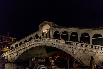 Fototapeta na wymiar Night at Rialto bridge over the grand canal in Venice, Italy