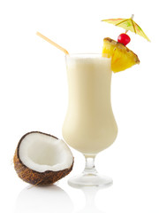 Pina colada cocktail with coconut on white background