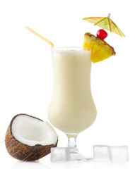 Pina colada cocktail with coconut and ice cubes on white background