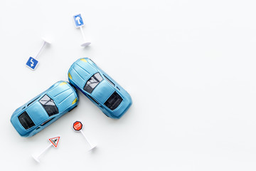 Toy cars for car insurance on white background top view mock up