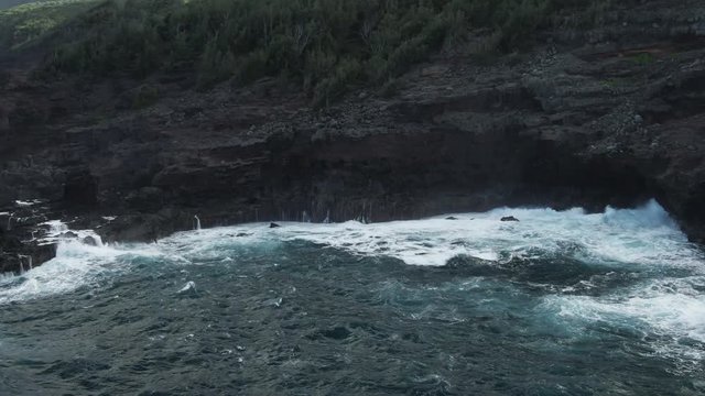 Wave crashes on shore in Lahaina, Hawaii