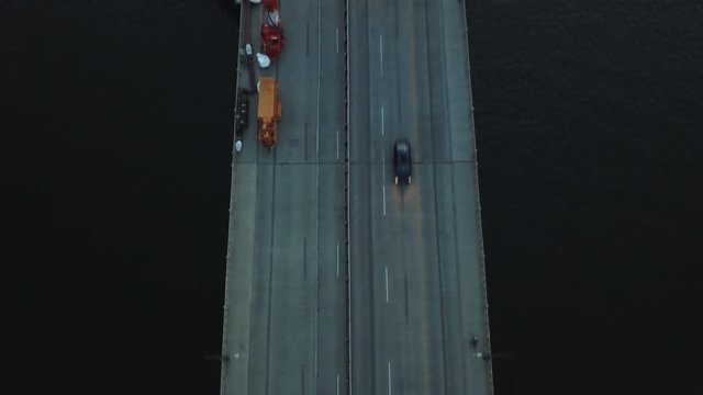 Overhead aerial, cars drive on bridge in Portland, Oregon