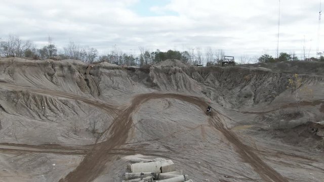 Riding dirt bike on track, aerial view
