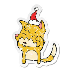 distressed sticker cartoon of a fox wearing santa hat