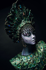 Head of woman mannequin in green decorated kokoshnick