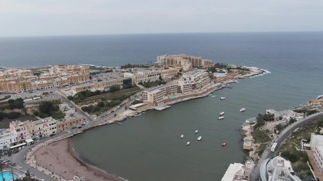 Buildings overlook Mediterranean Sea in Malta, aerial view