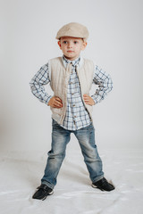 Little boy in a cap posing