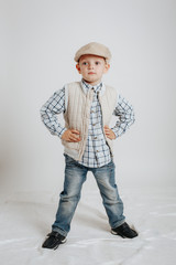 Little boy in a cap posing