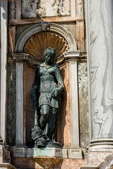 Obraz premium Italy, Venice, a statue in front of a door