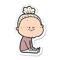 sticker of a cartoon happy old woman
