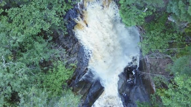 Overhead aerial, Miners Falls in forest of Munising Township, Michigan