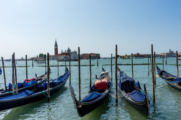 Fototapeta na wymiar Italy, Venice, Church of San Giorgio Maggiore, BOATS MOORED IN CANAL