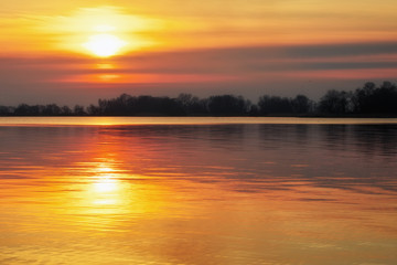 Seascape with colorful sunset sky and sea. Beach at dawn