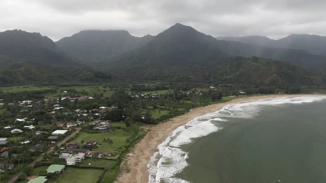 Beach community near mountains in Hanalei Bay, Hawaii, aerial view