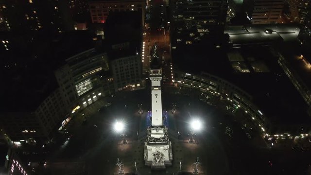Aerial, monument in downtown Indianapolis, Indiana at night