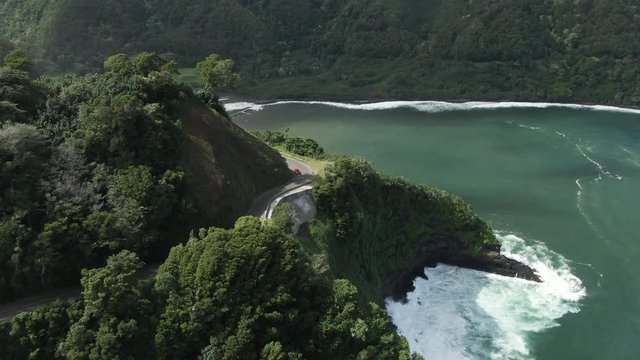 Car drives on Road on Hana in Maui, Hawaii, aerial